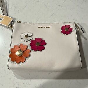 Michael Kors clutched purse.